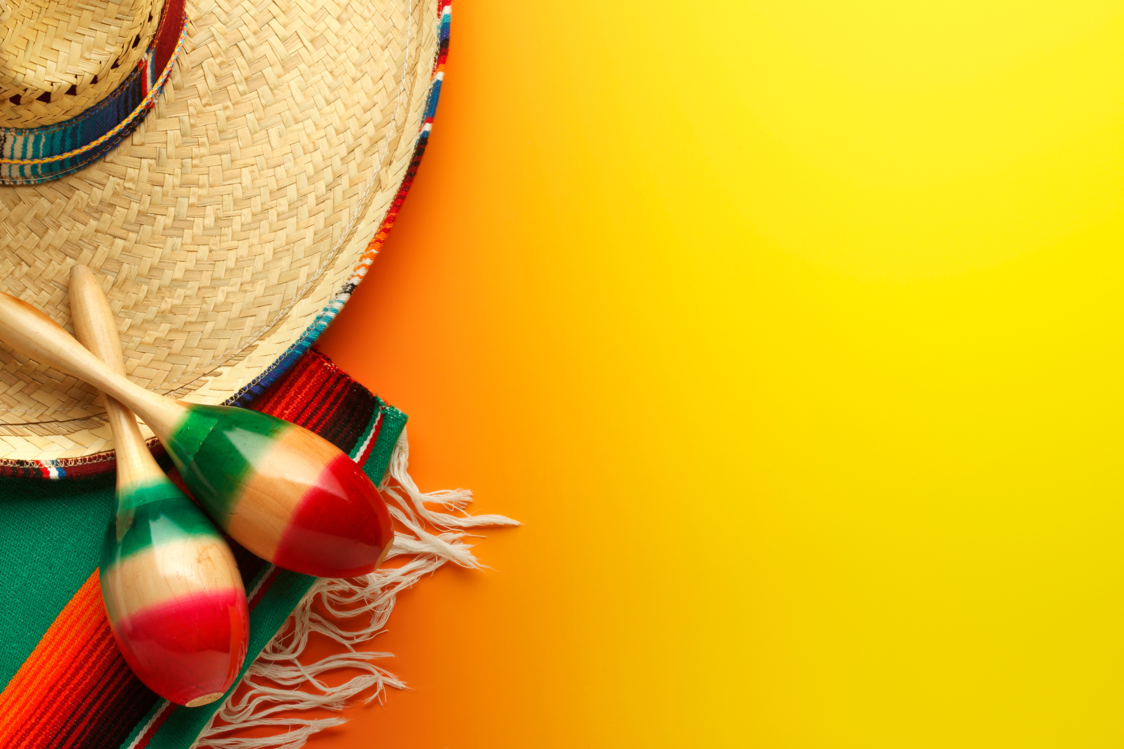 Cinco de Mayo Sombrero and Maracas On Yellow Background